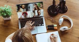 employee-working-remotely-at-desk-with-work-items
